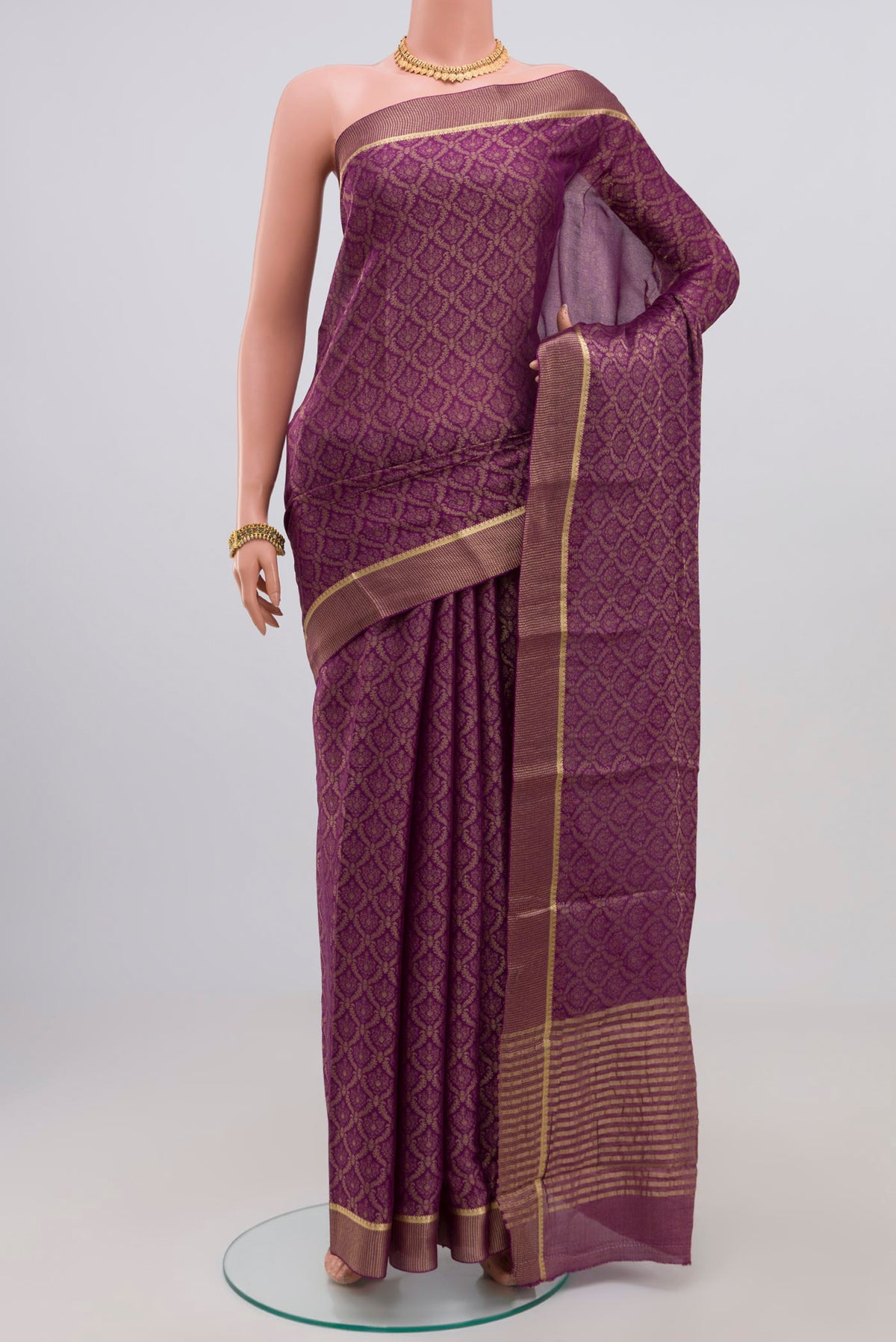 Purple Georgette Saree with Zari Brocade on the body and Zari Border.  displayed on a mannequin