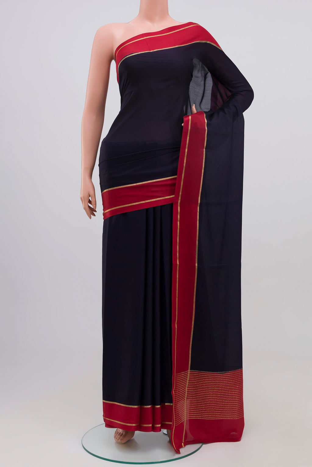 Navy Blue Mysore Crepe Saree with Plain Body and Zari Border.  displayed on a mannequin