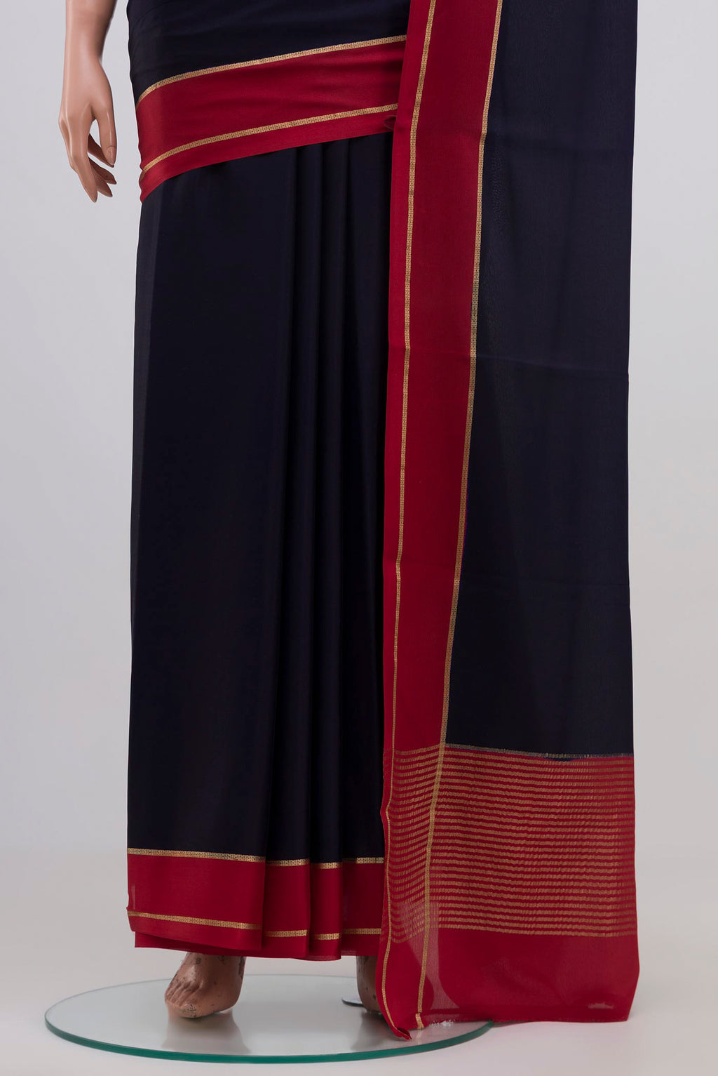 Pleats and pallu of Navy Blue Mysore Crepe Saree with Plain Body and Zari Border. 