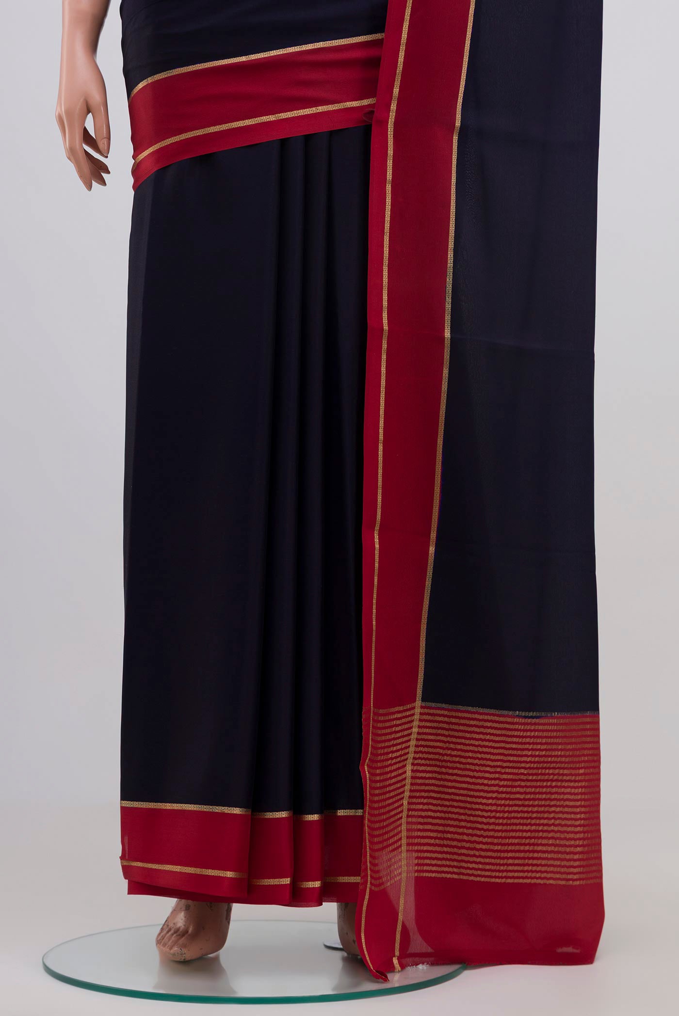 Pleats and pallu of Navy Blue Mysore Crepe Saree with Plain Body and Zari Border. 