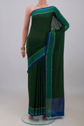 Bottle Green Mysore Crepe Saree with Plain Body and Thin Zari Line.  displayed on a mannequin