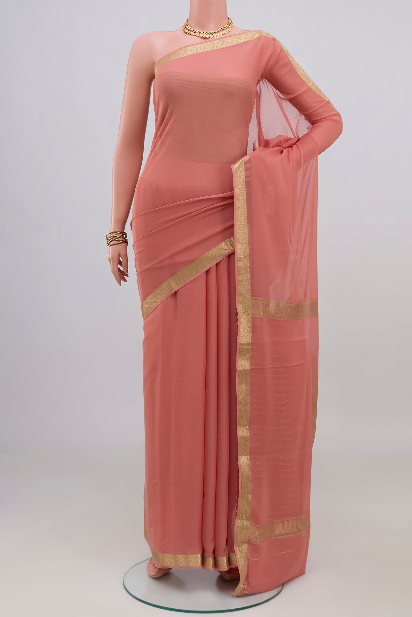 Rose Gold Mysore Chiffon Saree with Plain Body and Zari Border.  displayed on a mannequin