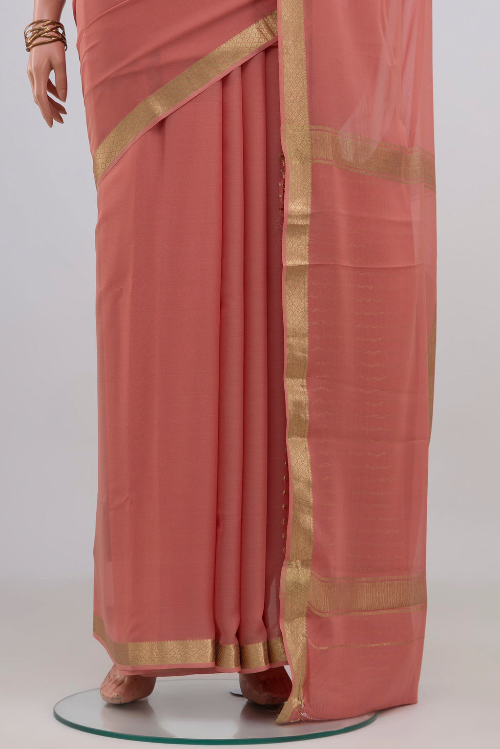 Pleats and pallu of Rose Gold Mysore Chiffon Saree with Plain Body and Zari Border. 