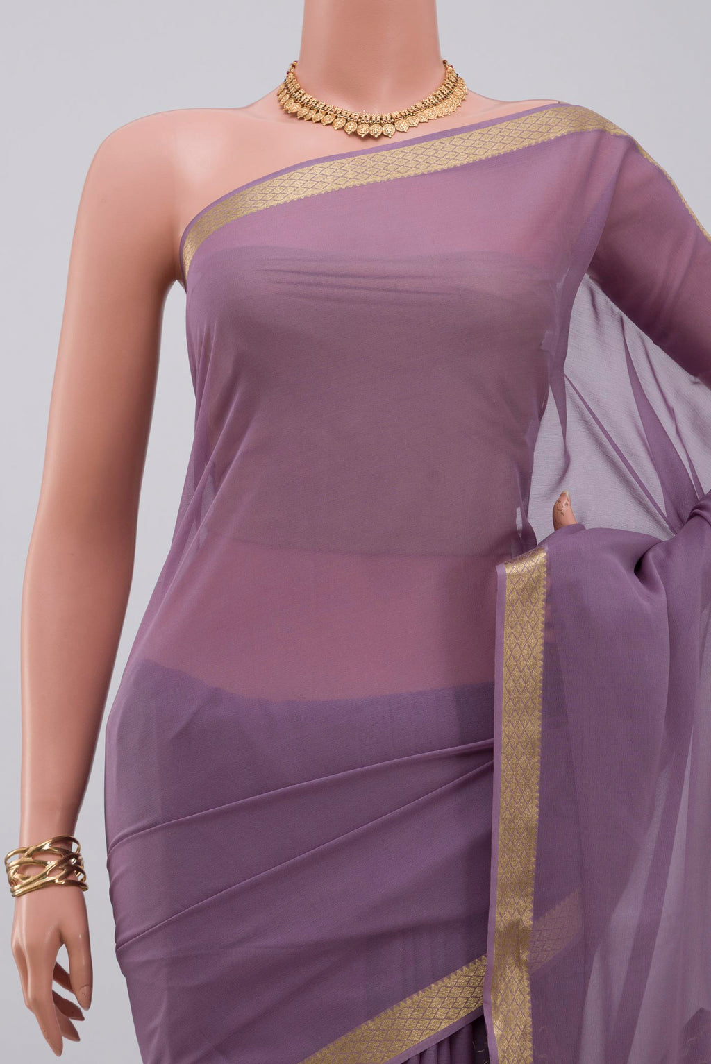 Border image of Lavender Georgette Saree with Plain Body and Zari Border. 