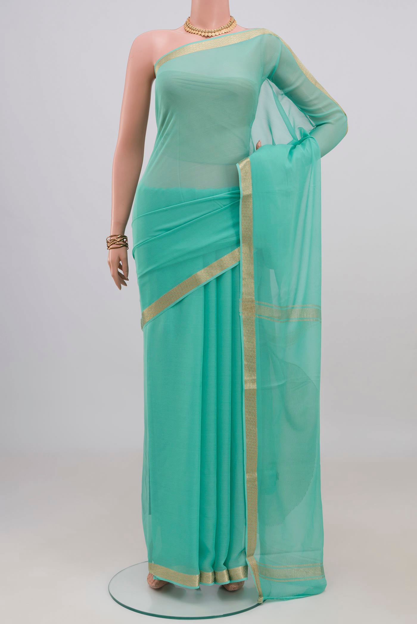 Blue Mysore Chiffon Saree with Plain Body and Zari Border.  displayed on a mannequin