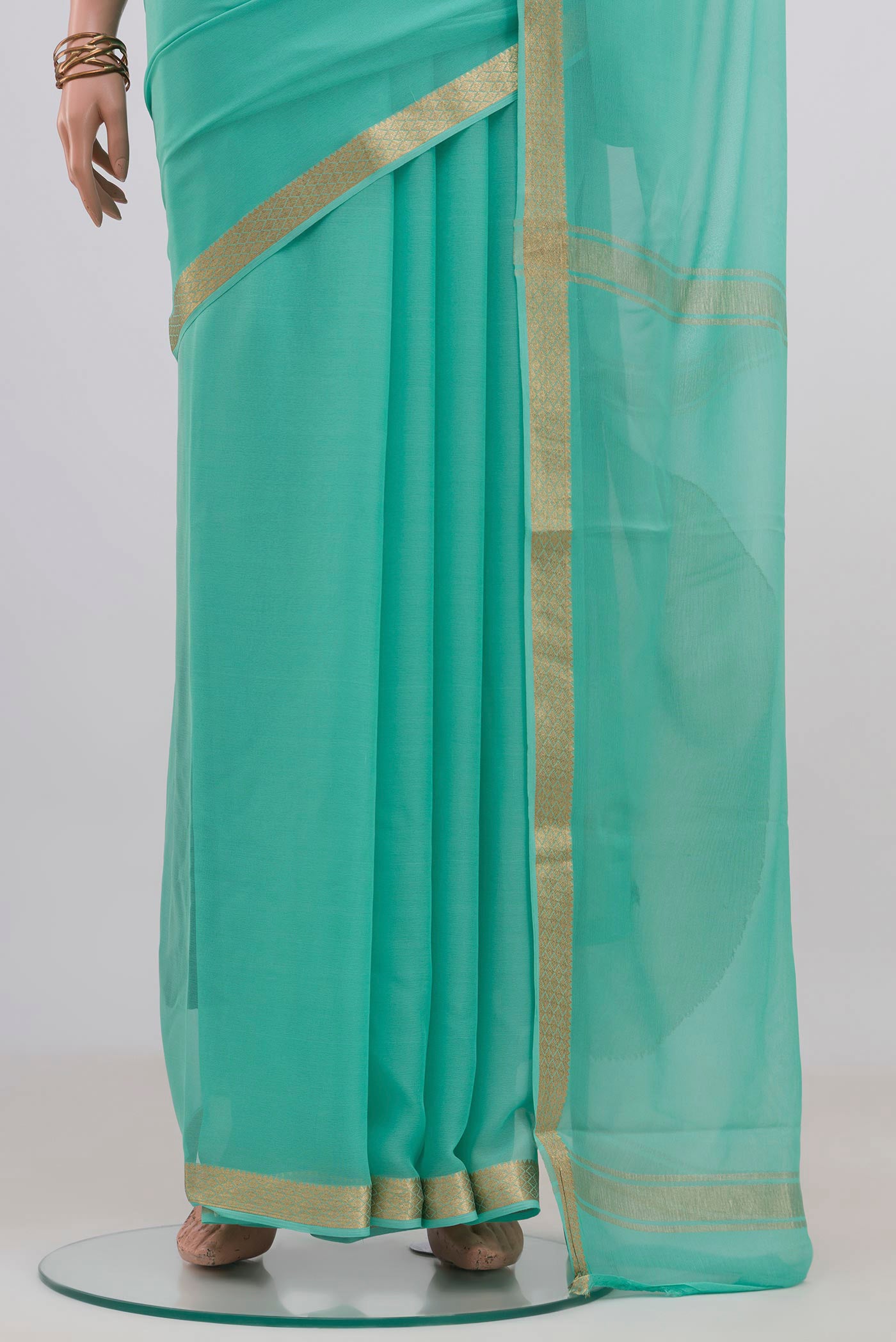Pleats and pallu of Blue Mysore Chiffon Saree with Plain Body and Zari Border. 