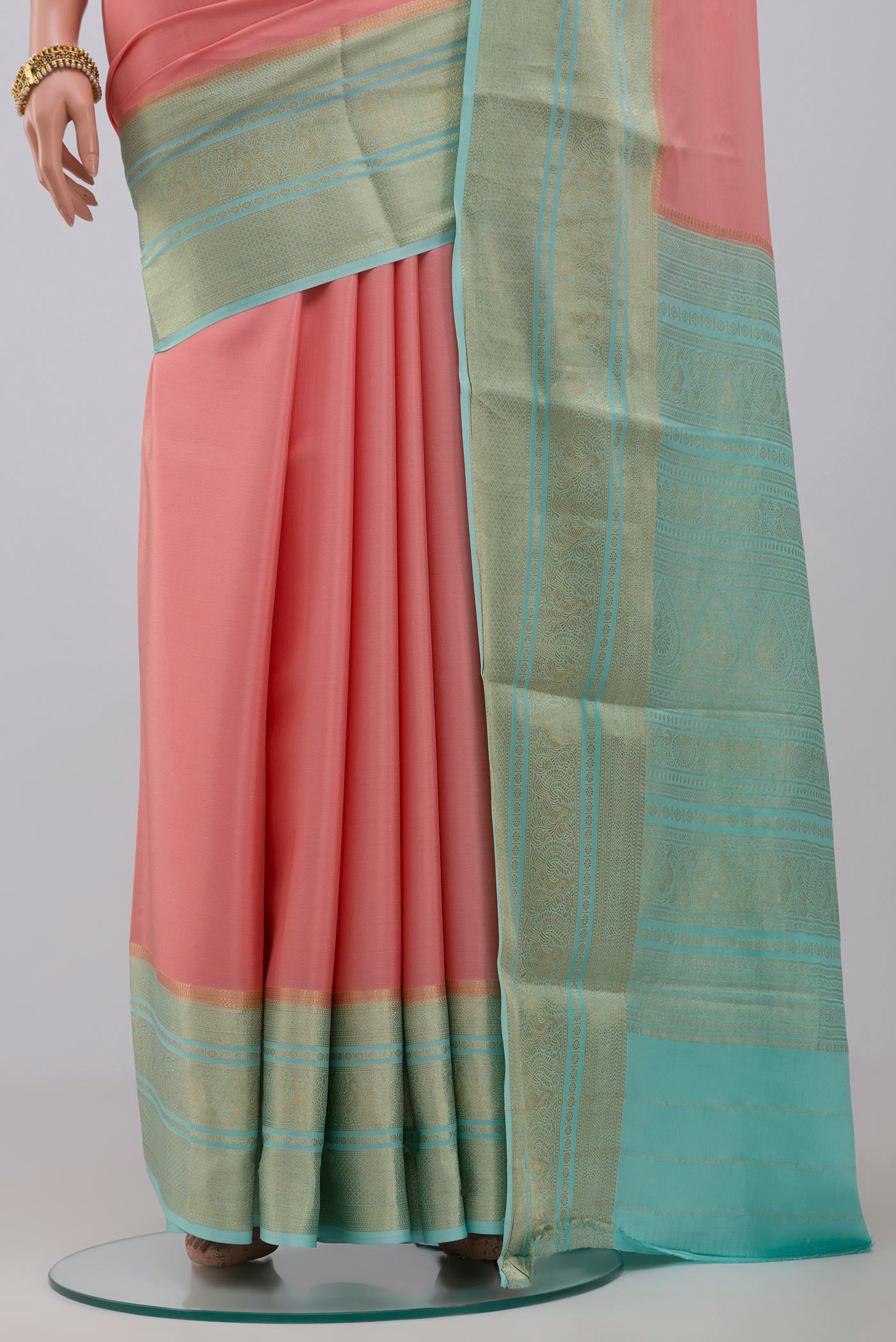 Pleats and pallu of Pink Crepe Saree with Plain Body and Zari Border. 