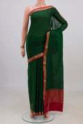 Bottle Green Mysore Crepe Saree with Plain Body and Zari Border.  displayed on a mannequin