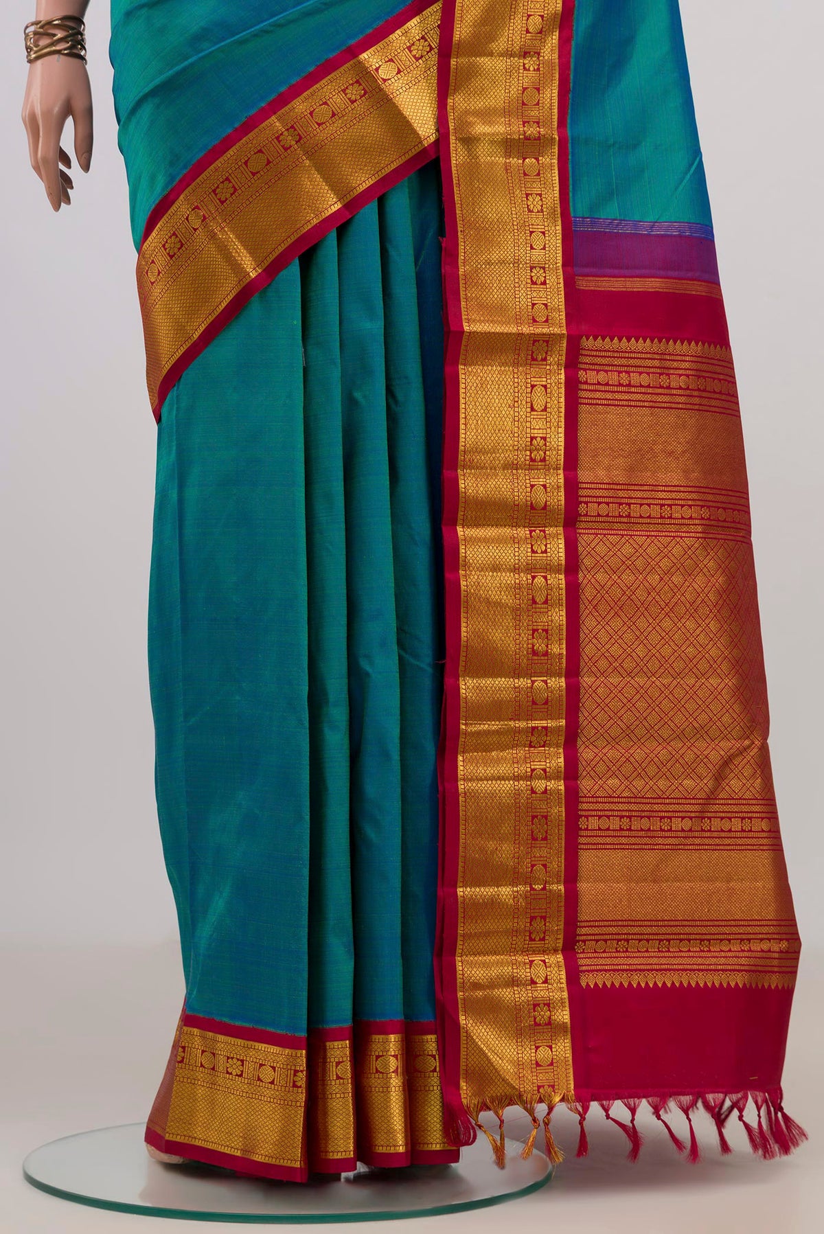Pleats and pallu of Pure Silk Blue Kanjivaram Saree with Plain Body and Zari Border. 