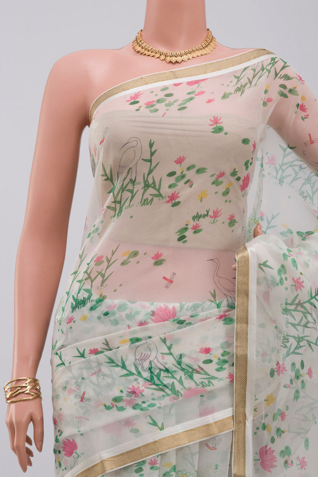 Border image of White Chiffon Saree with Printed design on the body and Zari Border. 