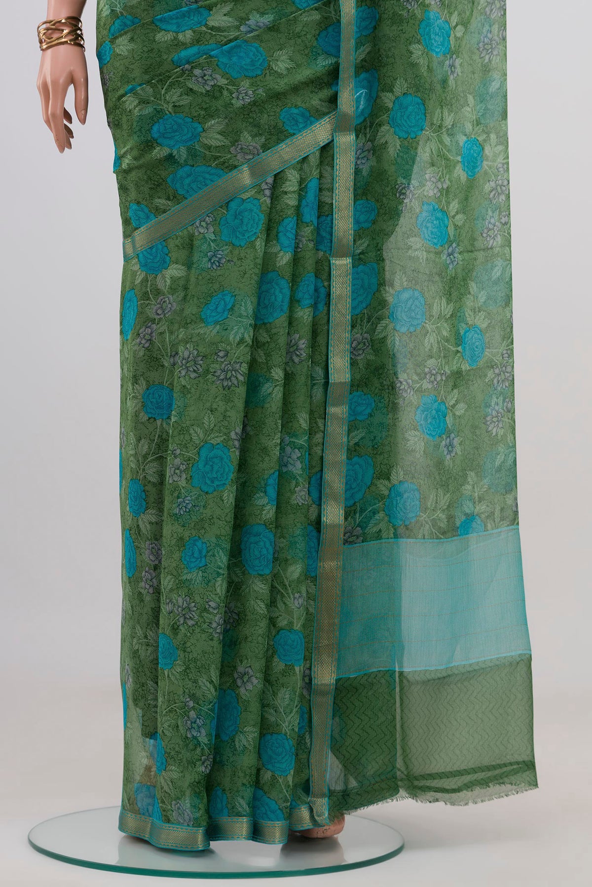 Pleats and pallu of Green Mysore Chiffon Saree with Floral Print on the body and Zari Border. 