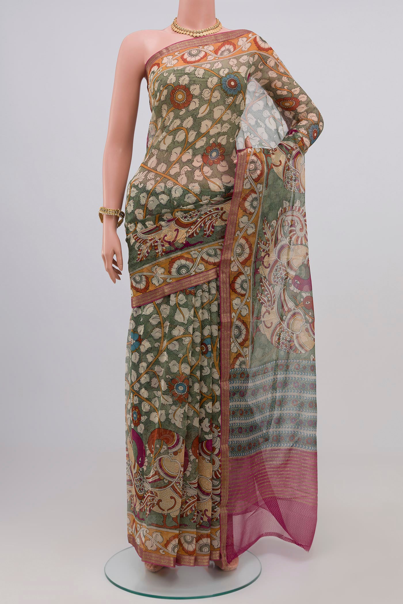 Light Green Chiffon Saree with Printed design on the body and Zari Border.  displayed on a mannequin