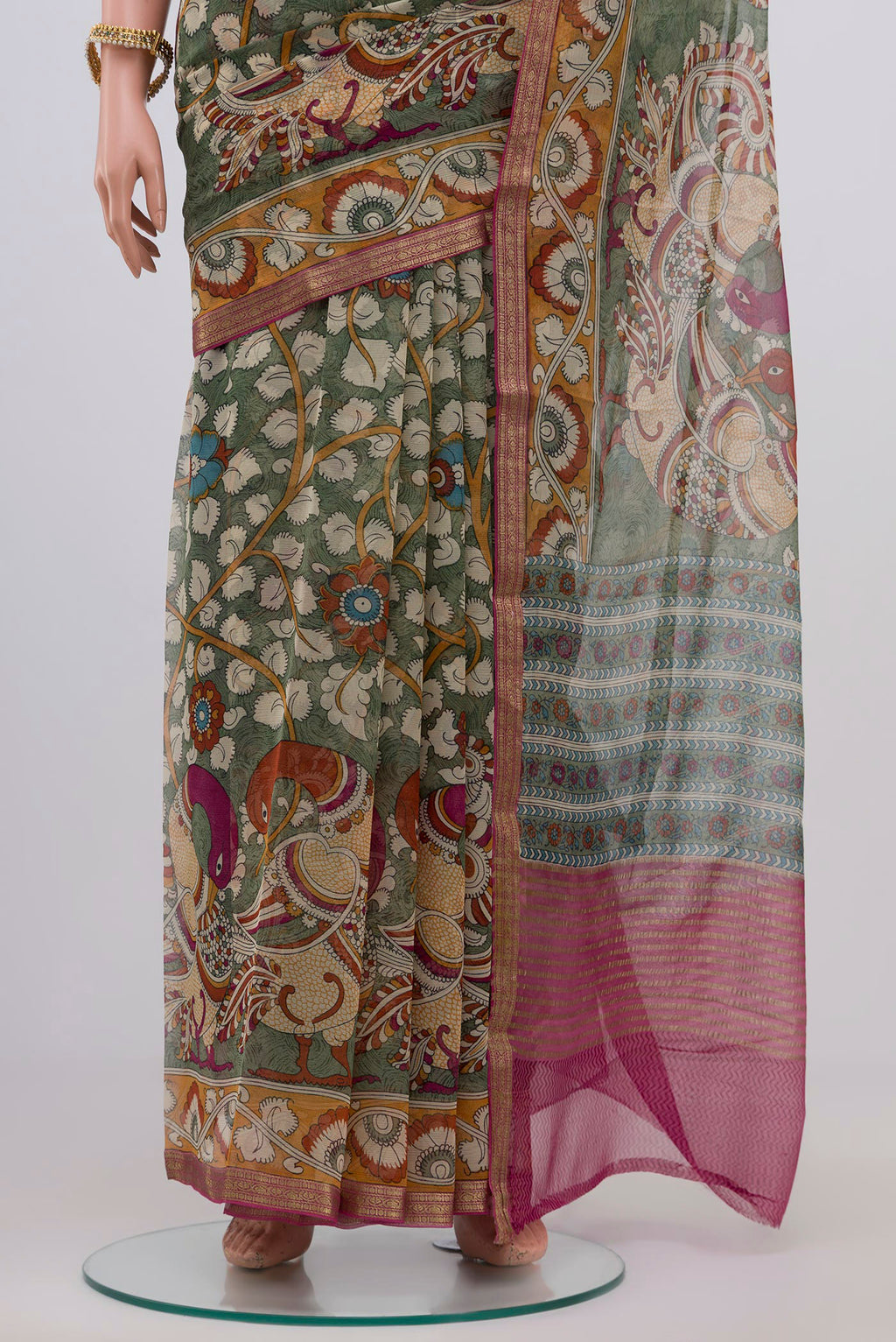 Pleats and pallu of Light Green Chiffon Saree with Printed design on the body and Zari Border. 