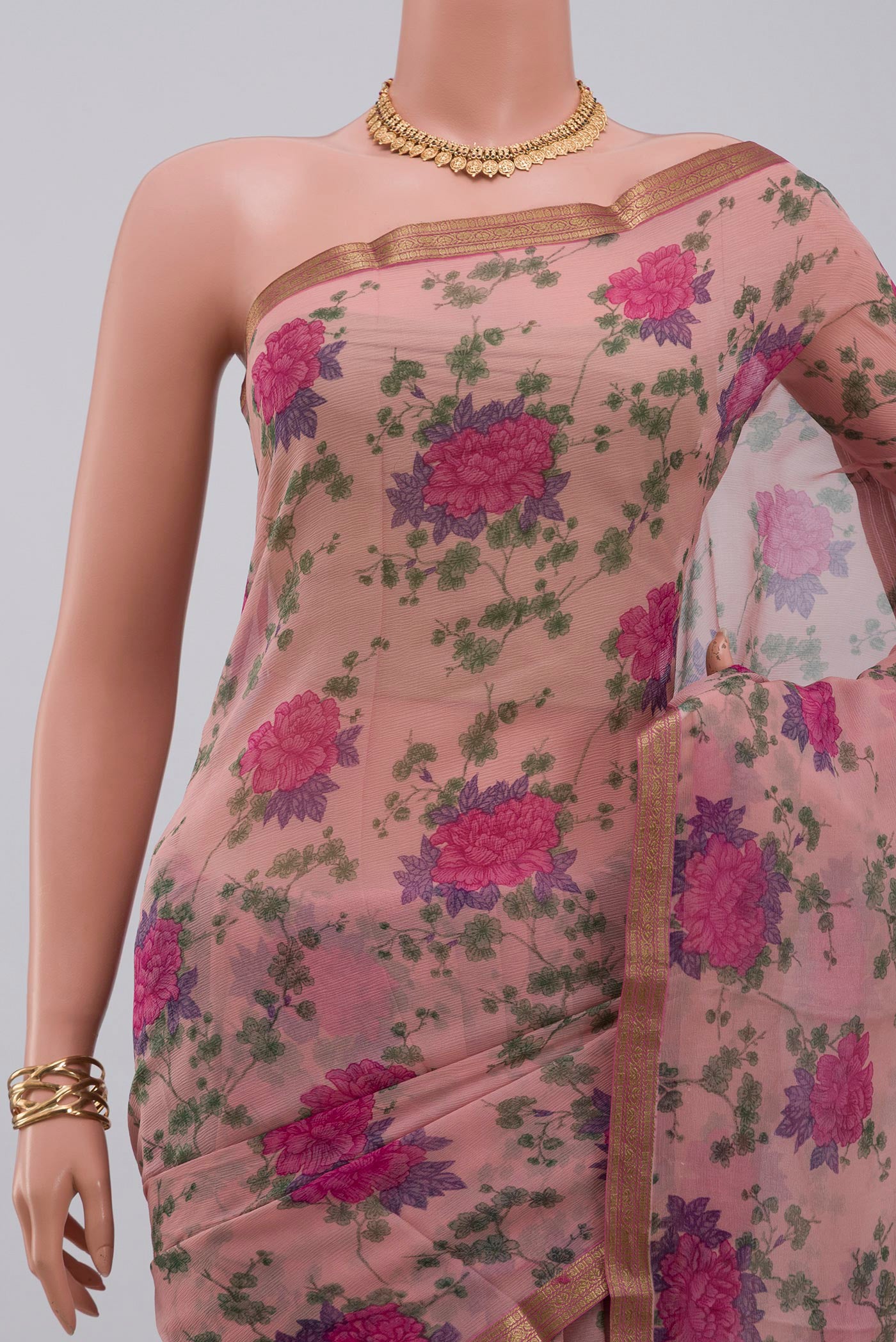Border image of Pink Chiffon Saree with Printed design on the body and Zari Border. 