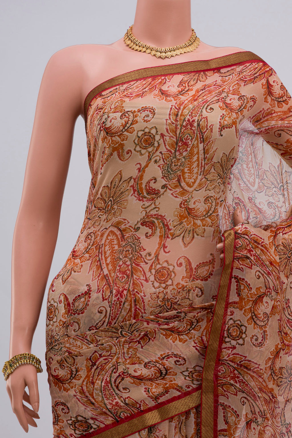 Border image of Cream Chiffon Saree with Printed design on the body and Zari Border. 