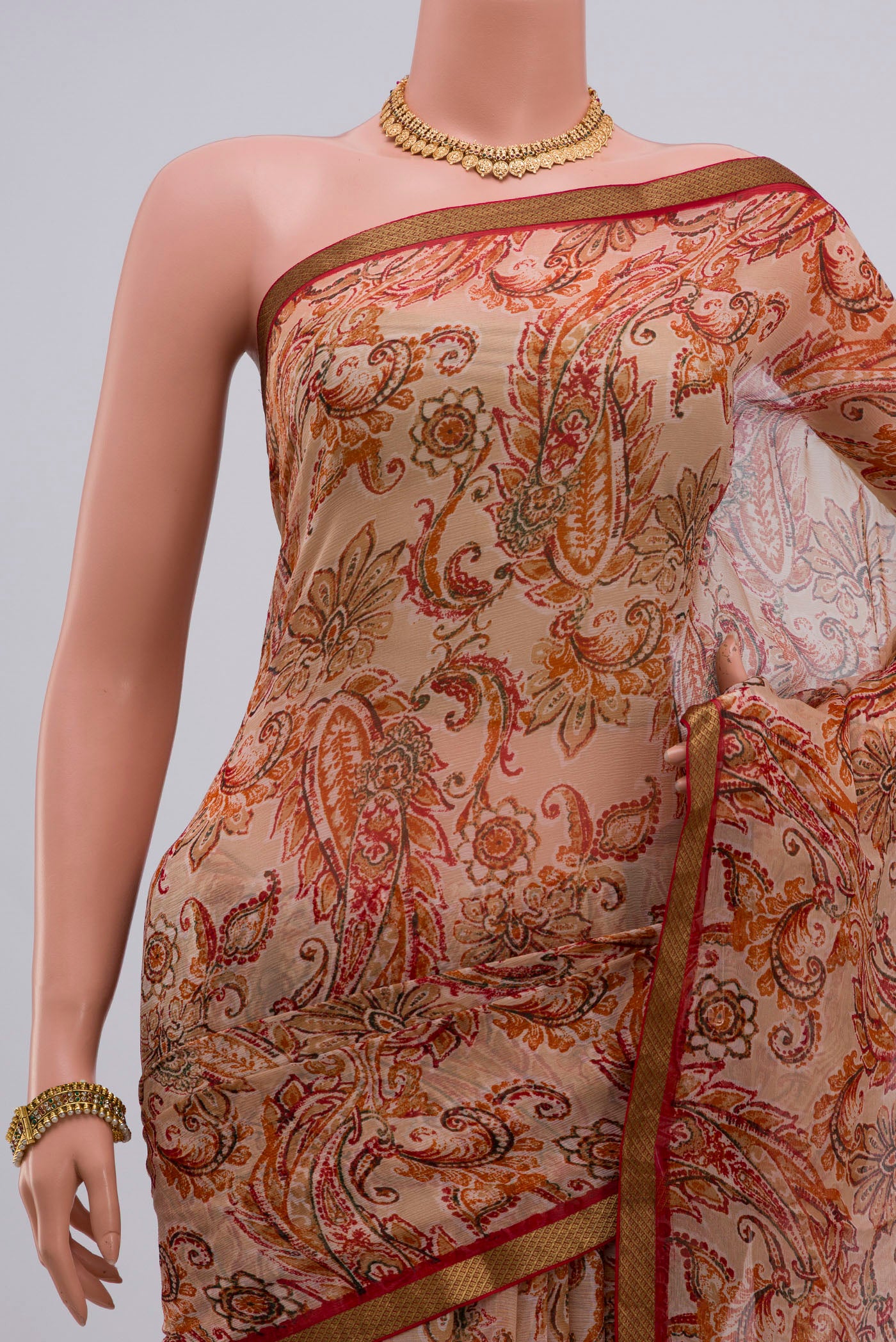 Border image of Cream Chiffon Saree with Printed design on the body and Zari Border. 