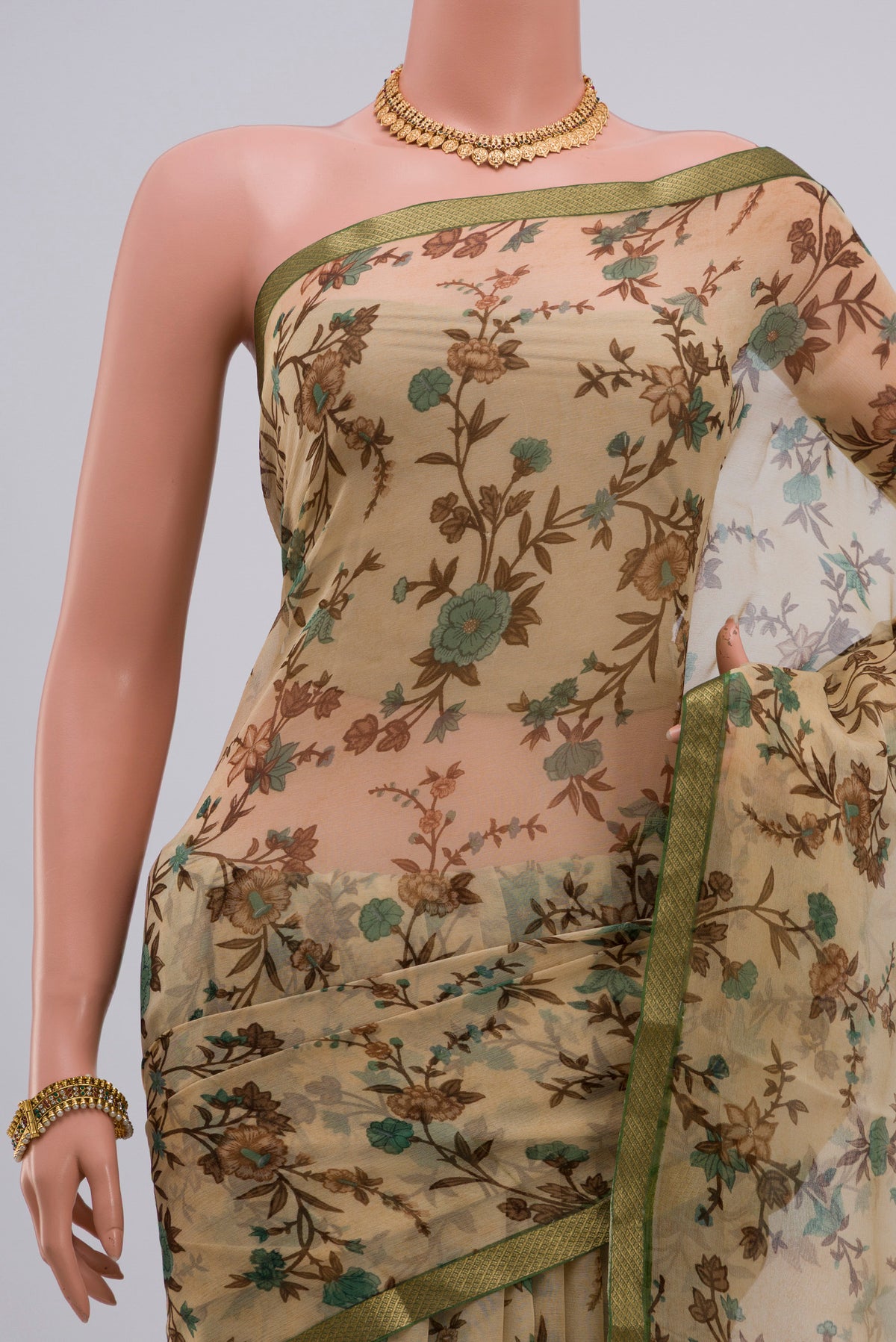 Border image of Cream Chiffon Saree with Printed design on the body and Zari Border. 