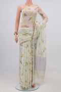 Cream Chiffon Saree with Printed design on the body and Zari Border.  displayed on a mannequin