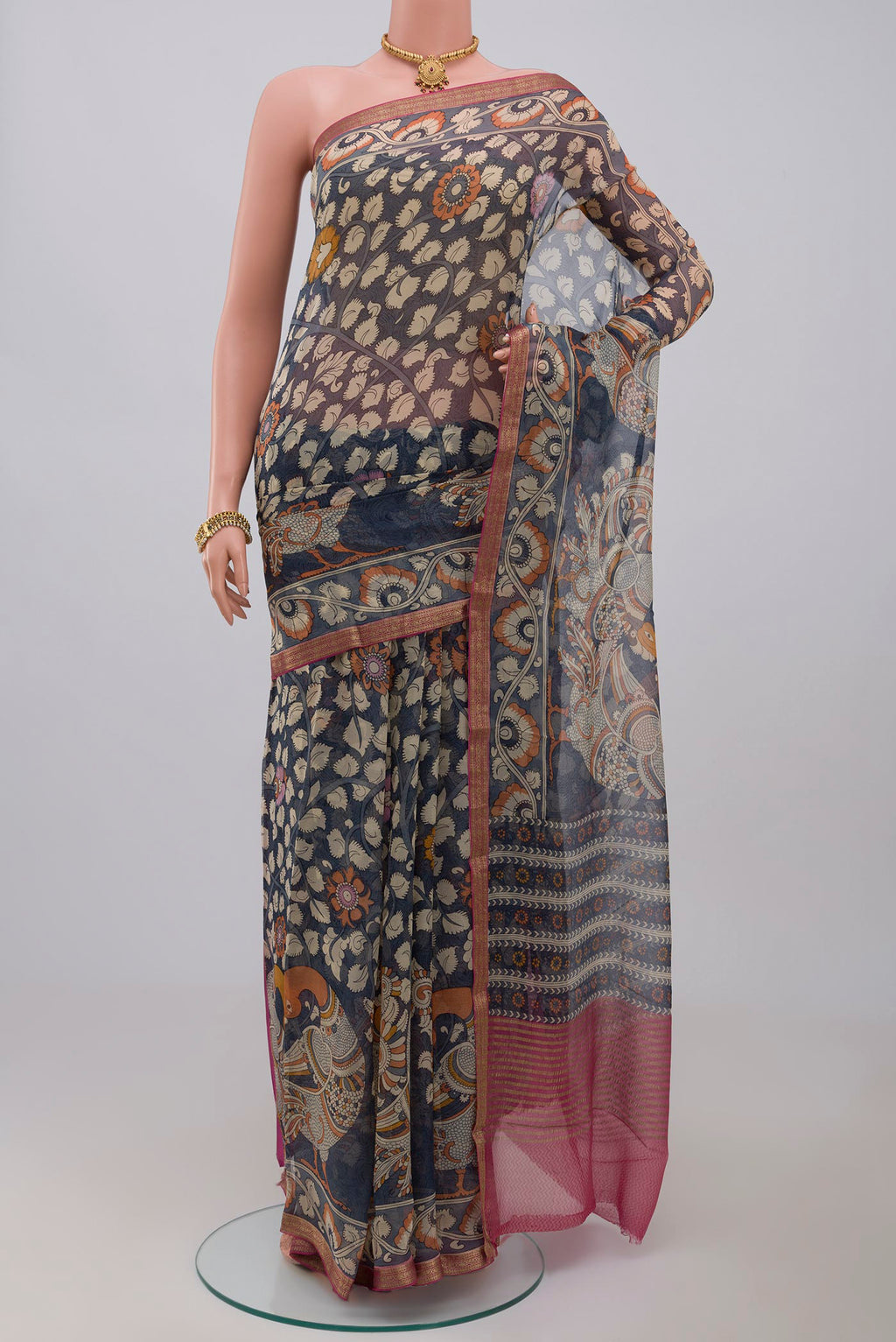 Blue Chiffon Saree with Printed design on the body and Thin Zari Line.  displayed on a mannequin