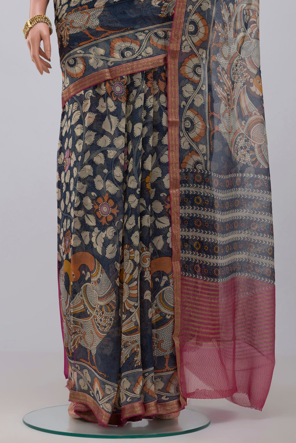 Pleats and pallu of Blue Chiffon Saree with Printed design on the body and Thin Zari Line. 