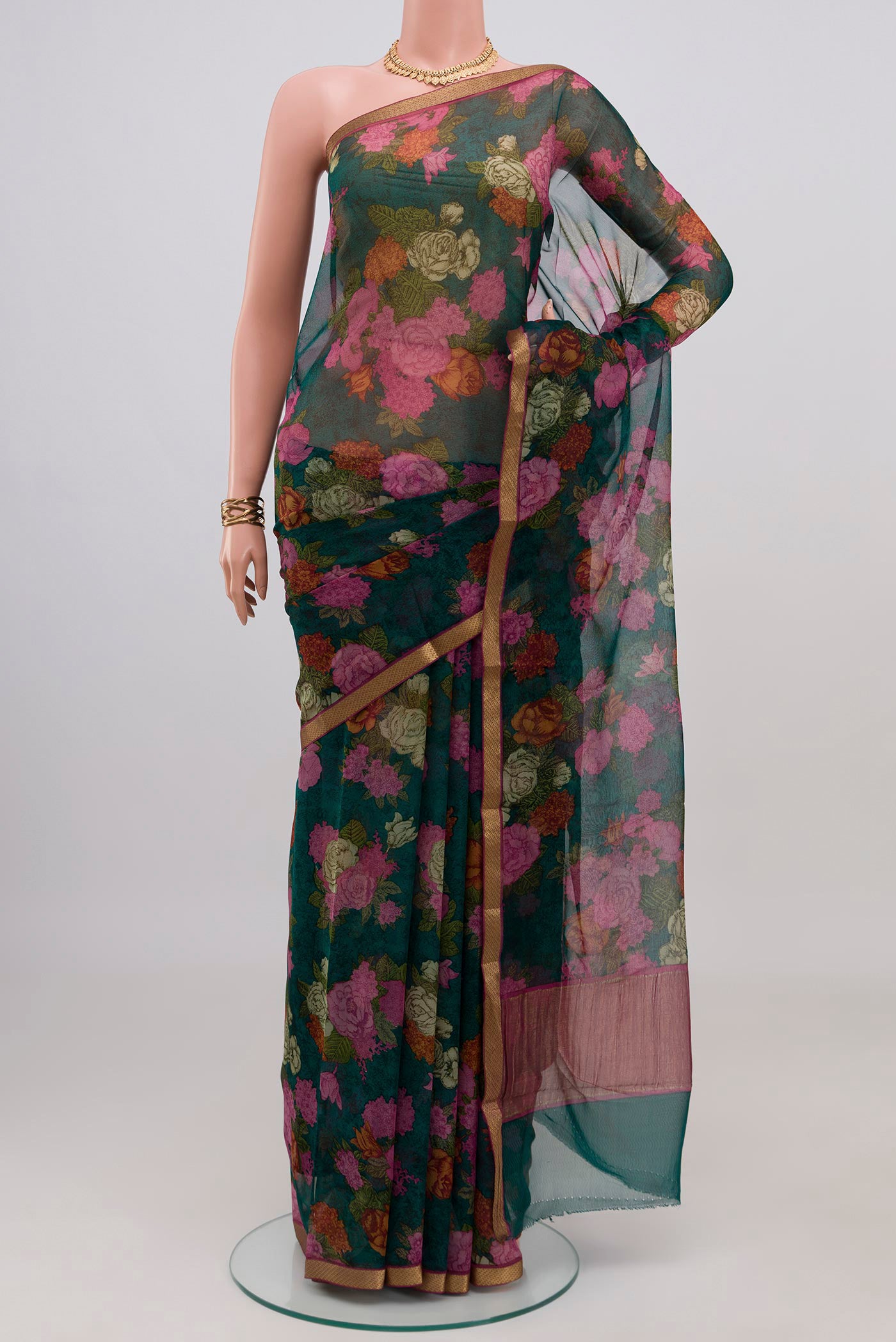 Green Mysore Chiffon Saree with Floral Print on the body and Zari Border.  displayed on a mannequin