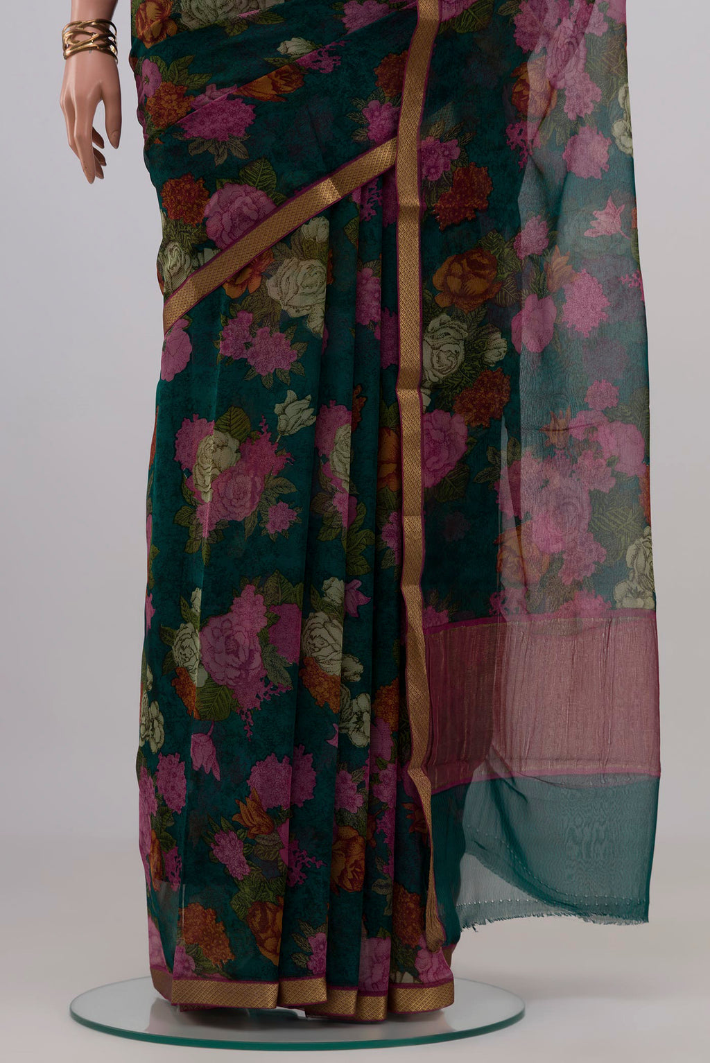 Pleats and pallu of Green Mysore Chiffon Saree with Floral Print on the body and Zari Border. 