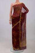 Maroon Chiffon Saree with Printed design on the body and Zari Border.  displayed on a mannequin