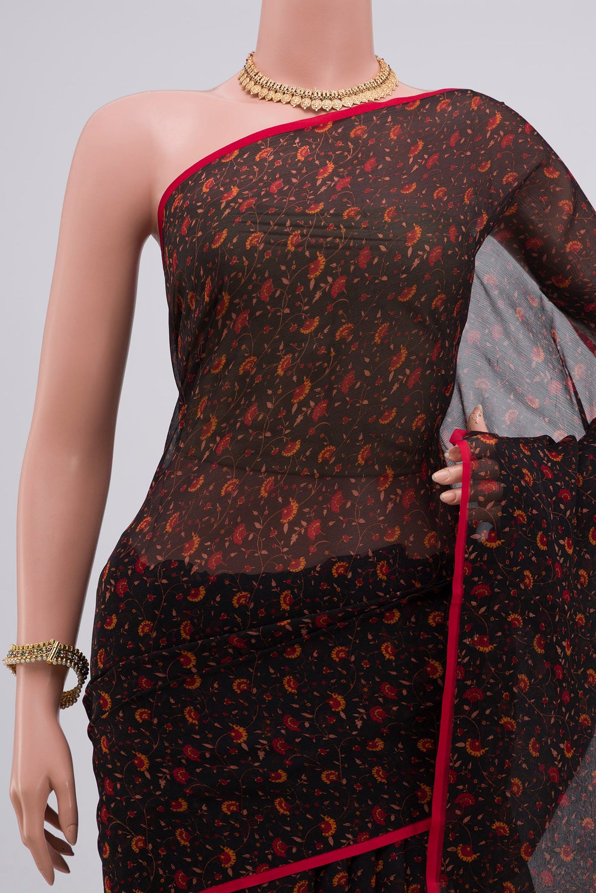 Border image of Black Chiffon Saree with Printed design on the body and Plain Border. 