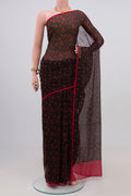 Black Chiffon Saree with Printed design on the body and Plain Border.  displayed on a mannequin