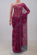 Pink Chiffon Saree with Printed design on the body and Without Border.  displayed on a mannequin