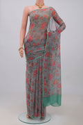 Grey Chiffon Saree with Printed design on the body and Without Border.  displayed on a mannequin