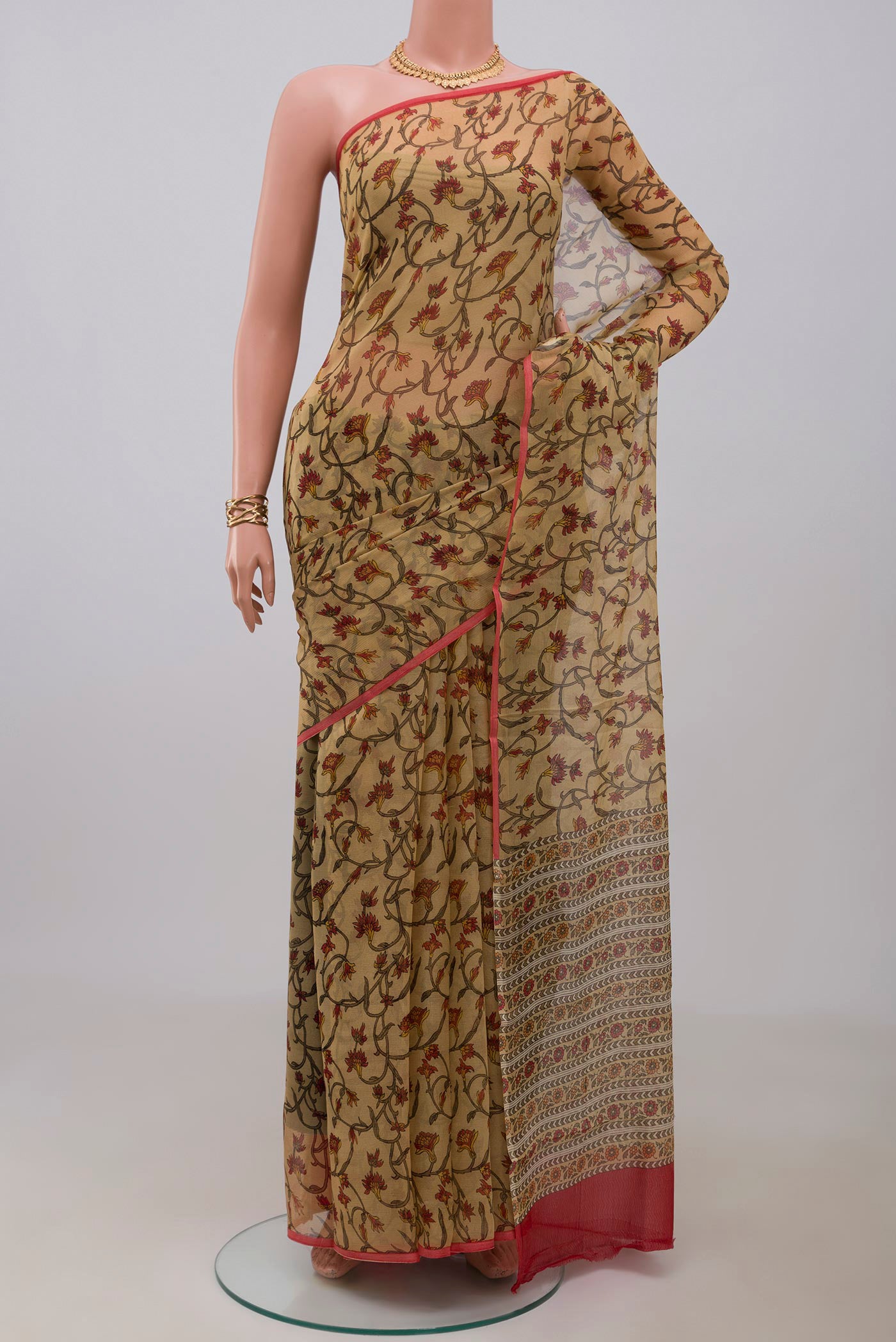 Beige Mysore Chiffon Saree with Printed design on the body and Without Border.  displayed on a mannequin