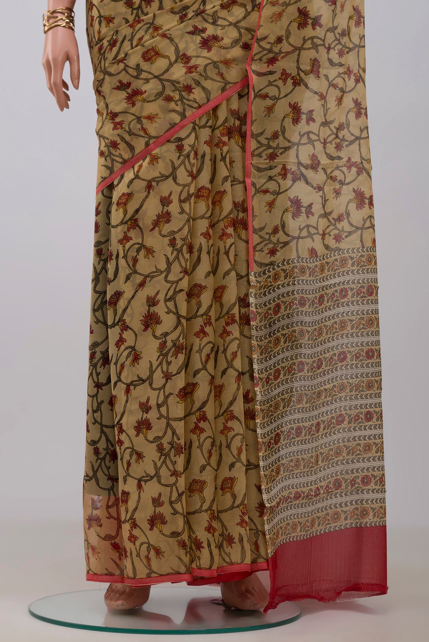 Pleats and pallu of Beige Mysore Chiffon Saree with Printed design on the body and Without Border. 