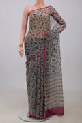 Grey Chiffon Saree with Printed design on the body and Without Border.  displayed on a mannequin