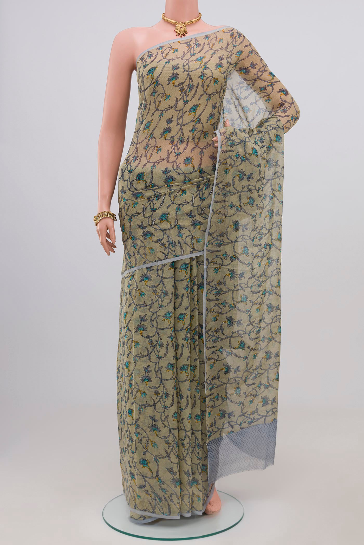 Light Green Chiffon Saree with Printed design on the body and Without Border.  displayed on a mannequin