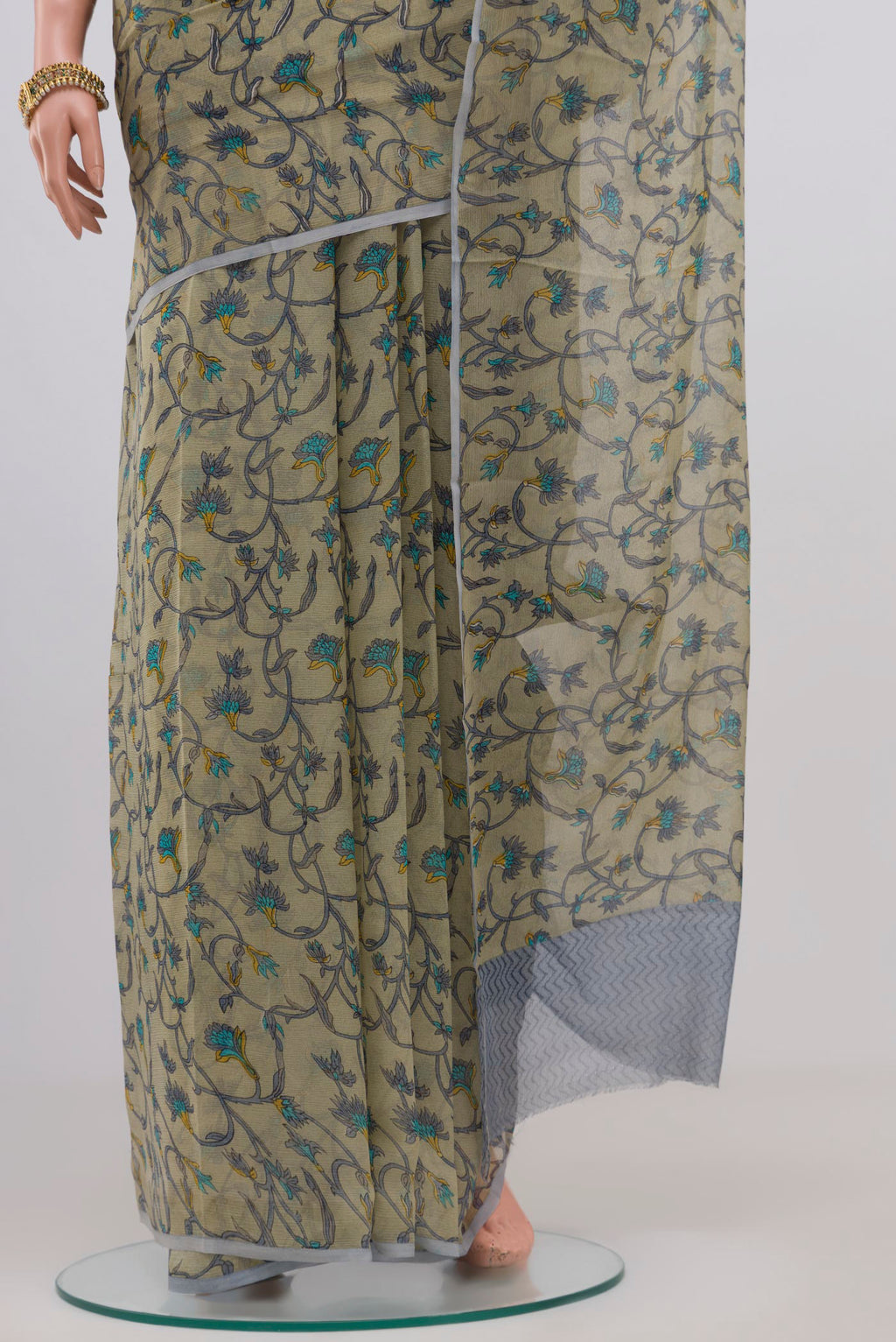 Pleats and pallu of Light Green Chiffon Saree with Printed design on the body and Without Border. 
