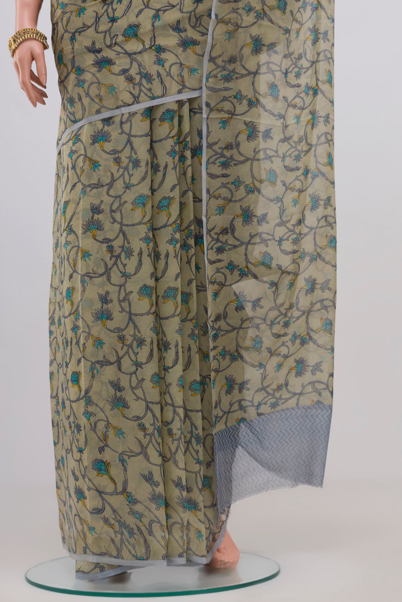 Pleats and pallu of Light Green Chiffon Saree with Printed design on the body and Without Border. 