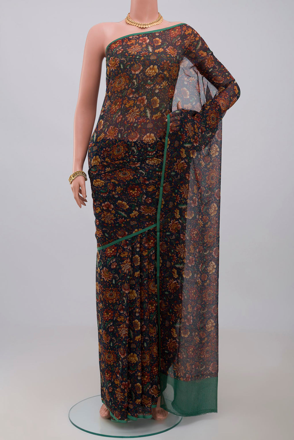 Blue Chiffon Saree with Printed design on the body and Without Border.  displayed on a mannequin