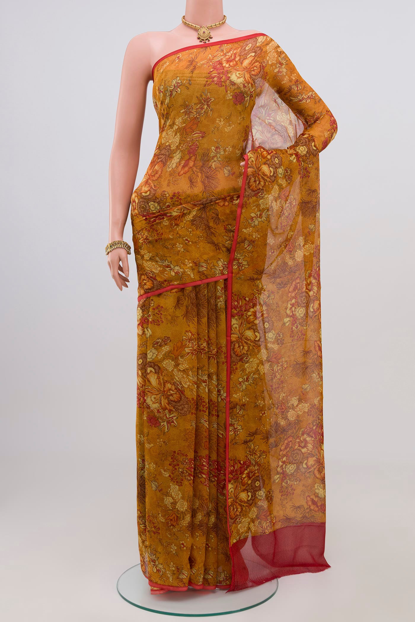 Mustard Chiffon Saree with Printed design on the body and Without Border.  displayed on a mannequin