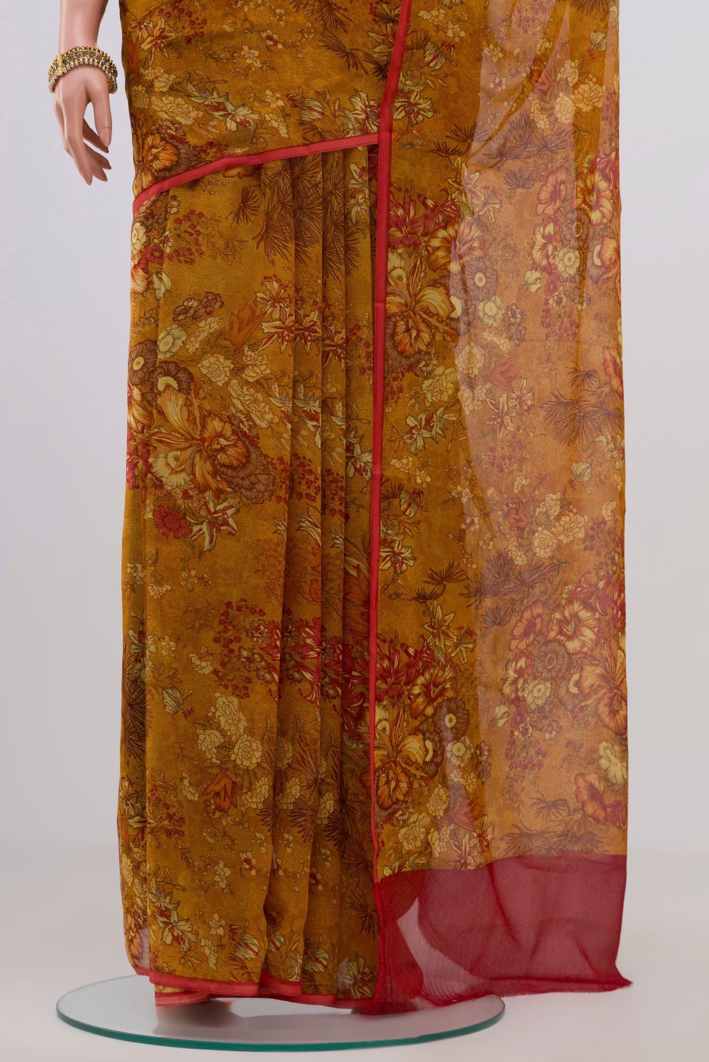 Pleats and pallu of Mustard Chiffon Saree with Printed design on the body and Without Border. 
