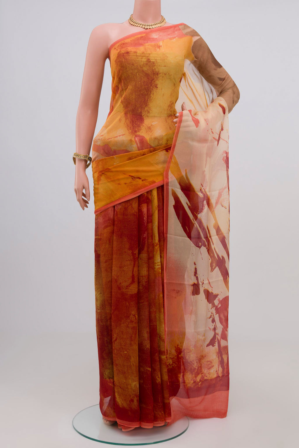 Yellow Chiffon Saree with Printed design on the body and Zari Border.  displayed on a mannequin