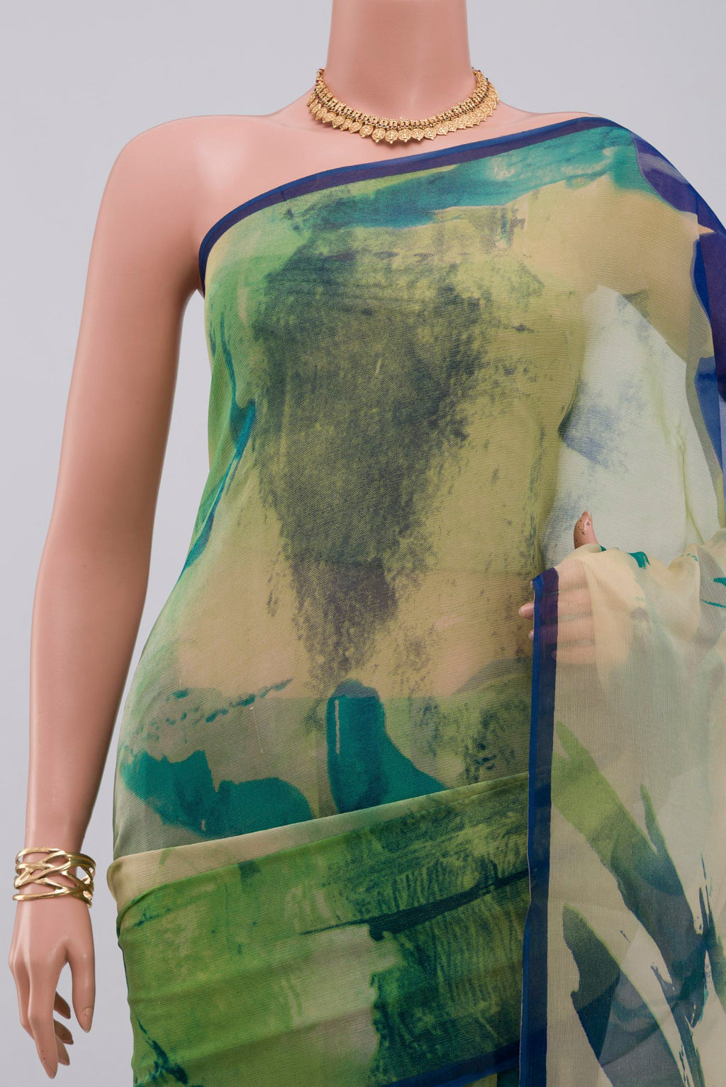 Border image of Green Chiffon Saree with Printed design on the body and Without Border. 
