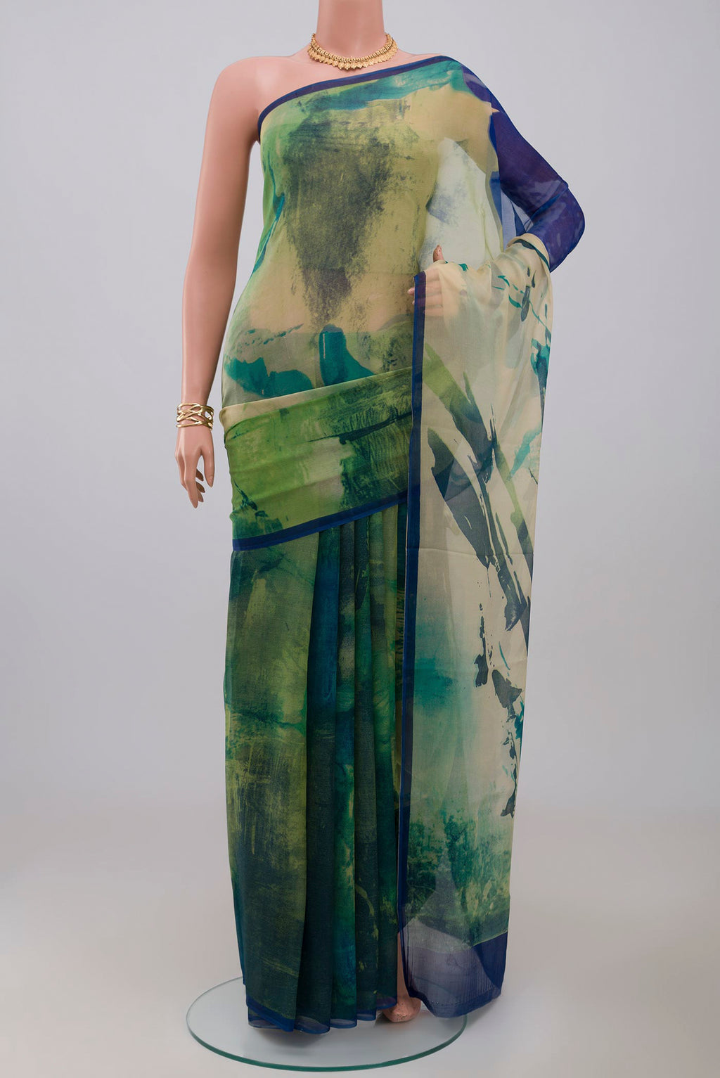 Green Chiffon Saree with Printed design on the body and Without Border.  displayed on a mannequin