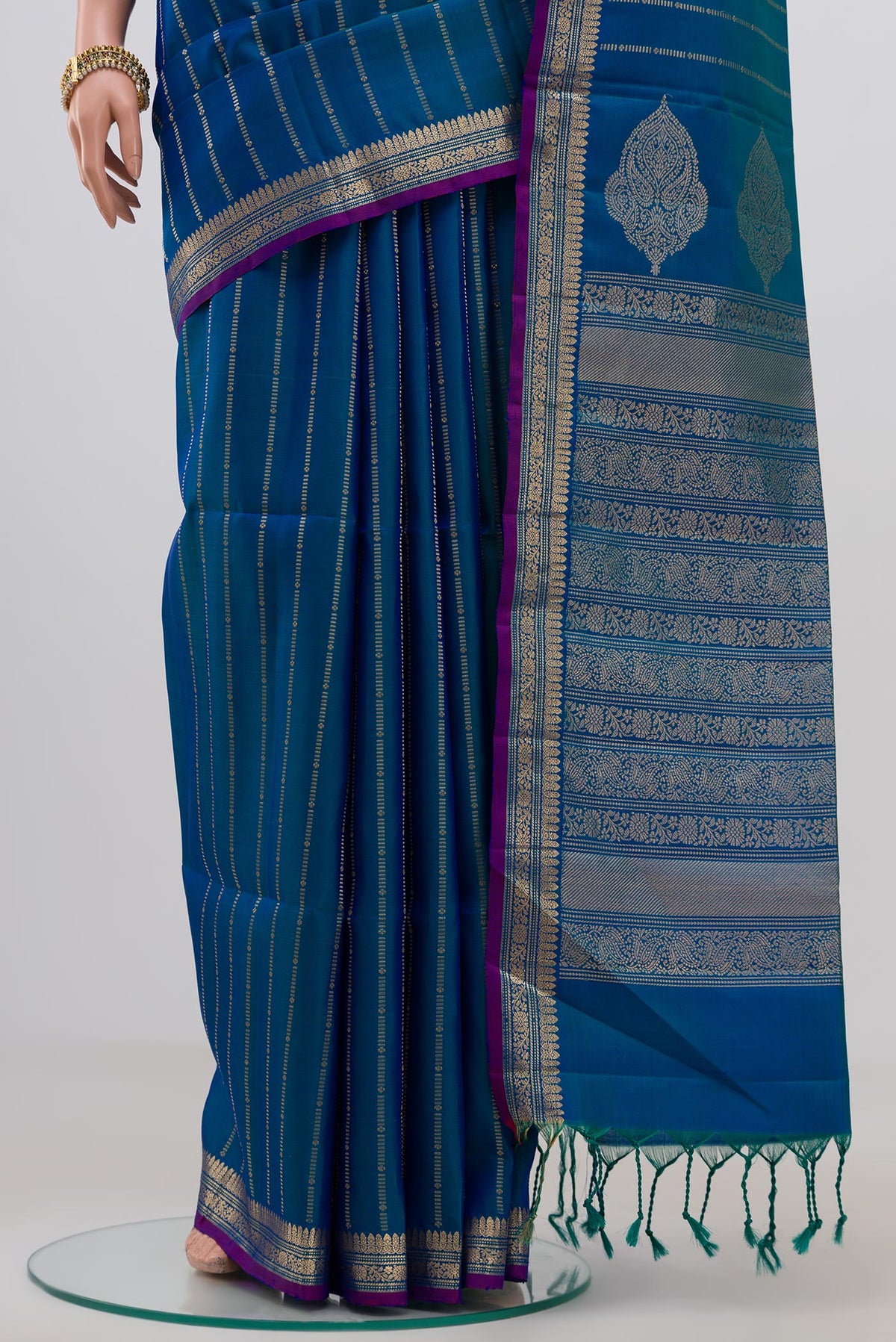 Pleats and pallu of Blue Soft Silk Saree with Stripes on the body and Zari Border. 