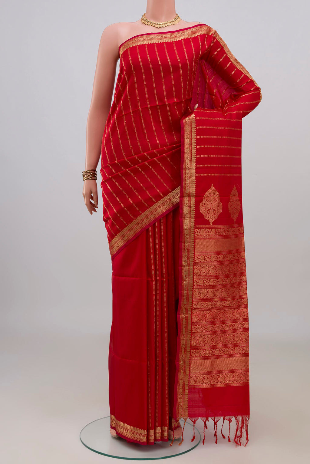 Pure Silk Red Soft Saree with Stripes on the body and Zari Border.  displayed on a mannequin