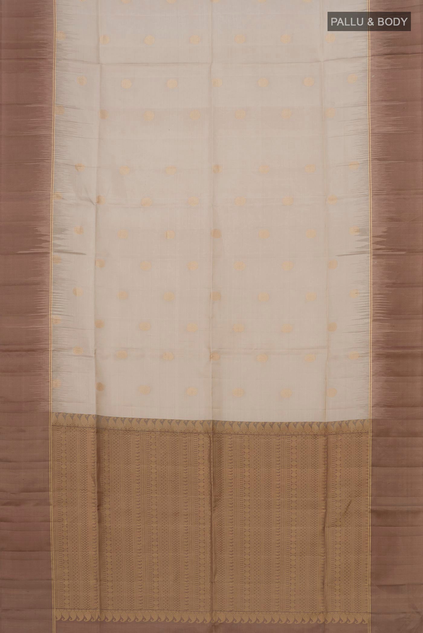 Flat view of Beige Soft Silk Saree with Zari Butta on the body and Plain Border. 