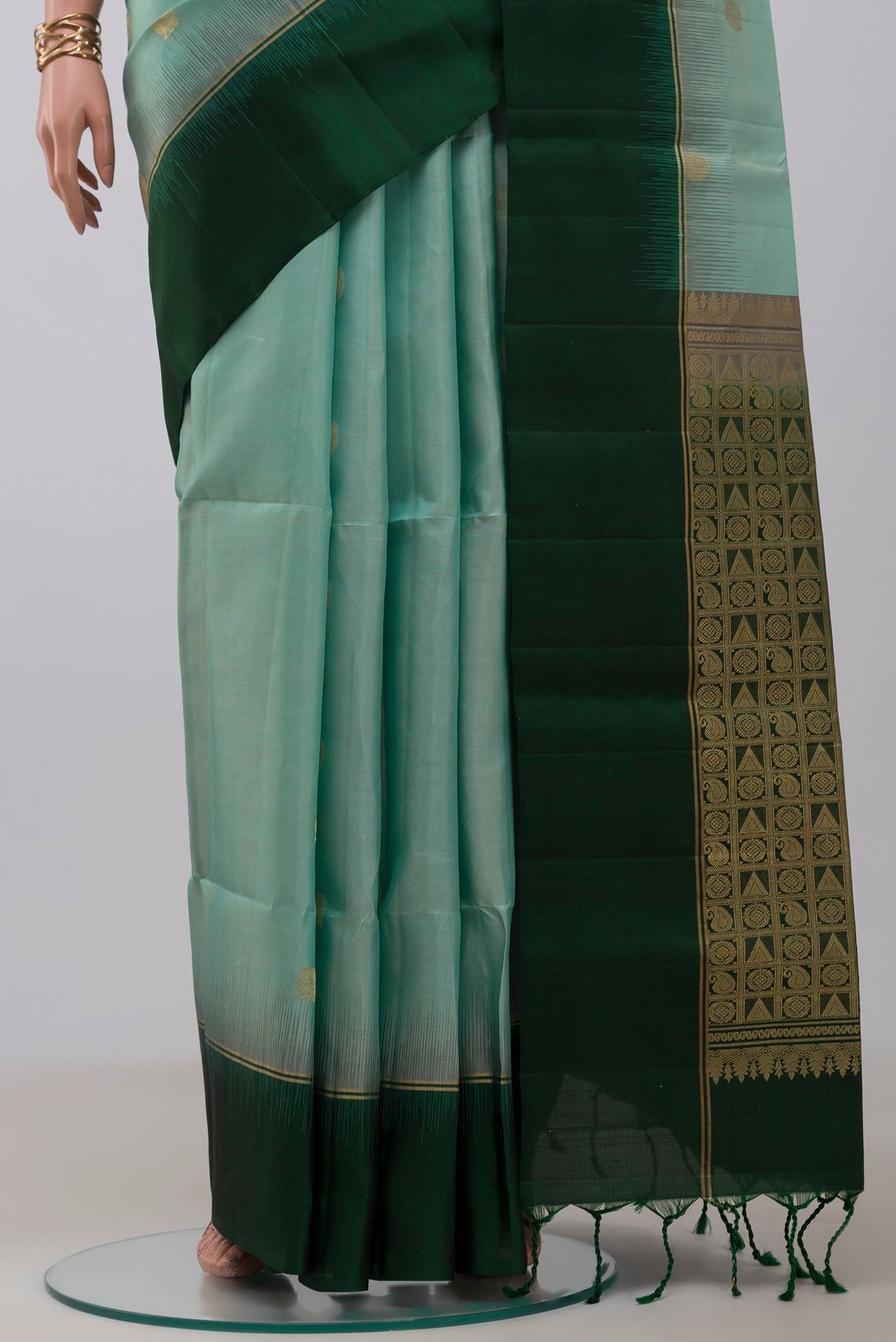 Pleats and pallu of Light Blue Soft Silk Saree with Zari Butta on the body and Plain Border. 