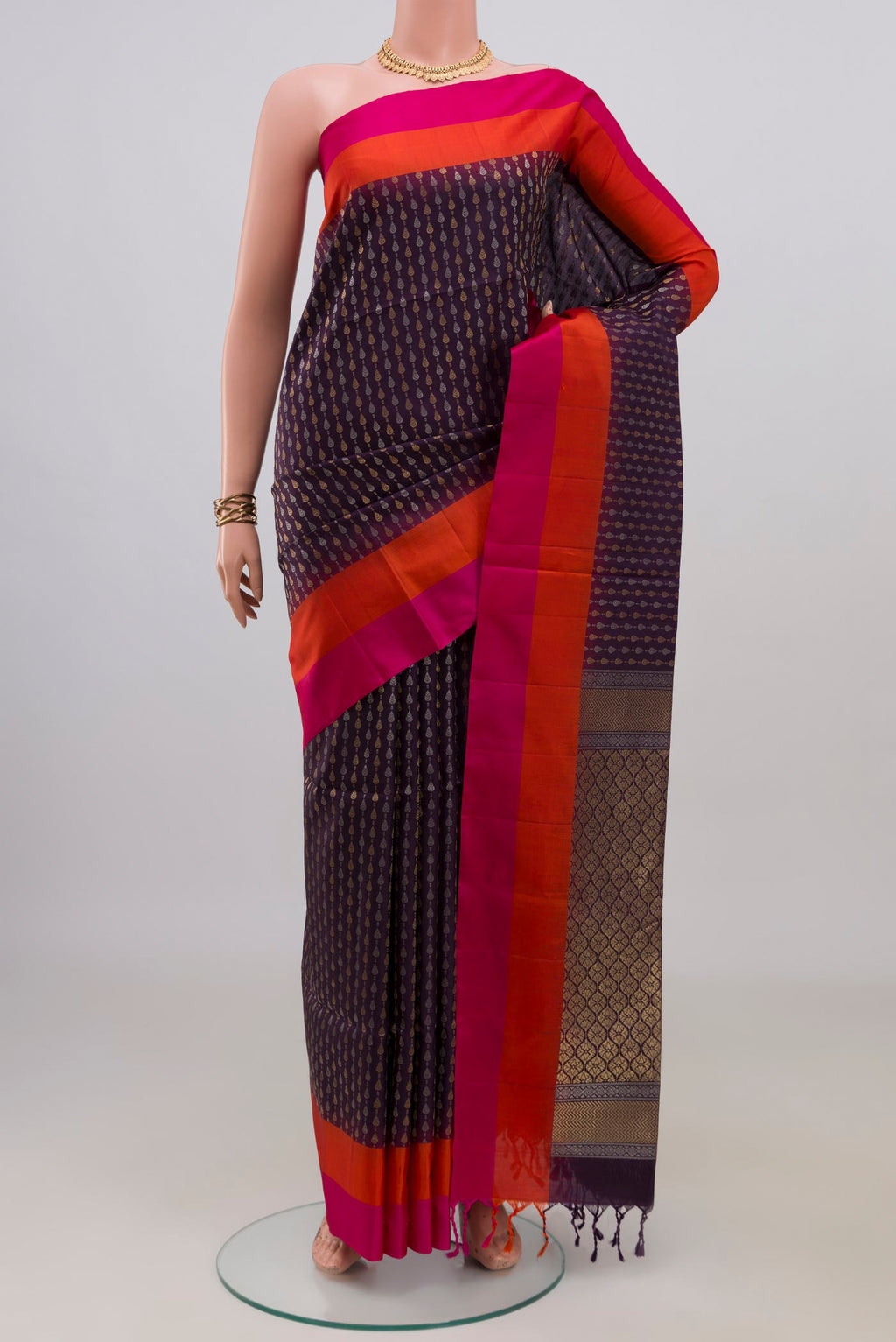 Pure Silk Purple Soft Saree with Zari Butta on the body and Plain Border.  displayed on a mannequin