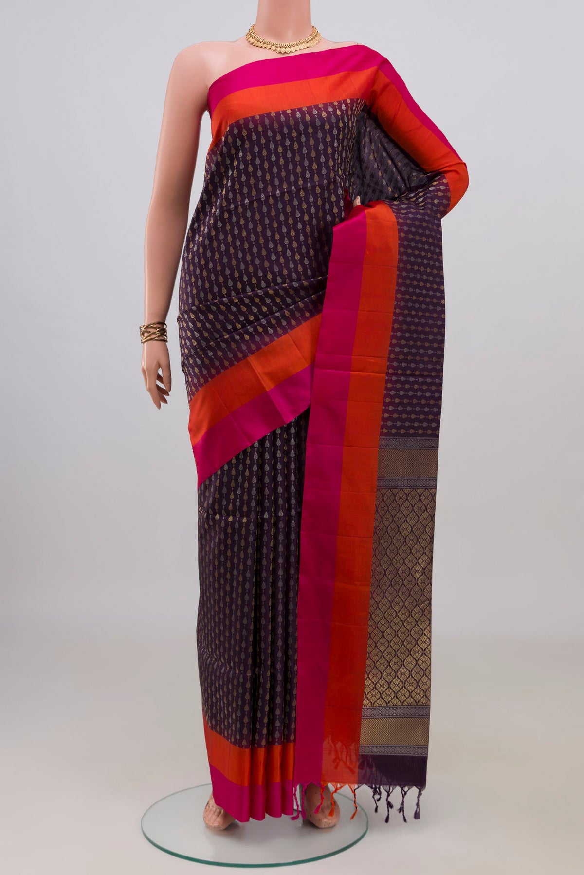 Pure Silk Purple Soft Saree with Zari Butta on the body and Plain Border.  displayed on a mannequin