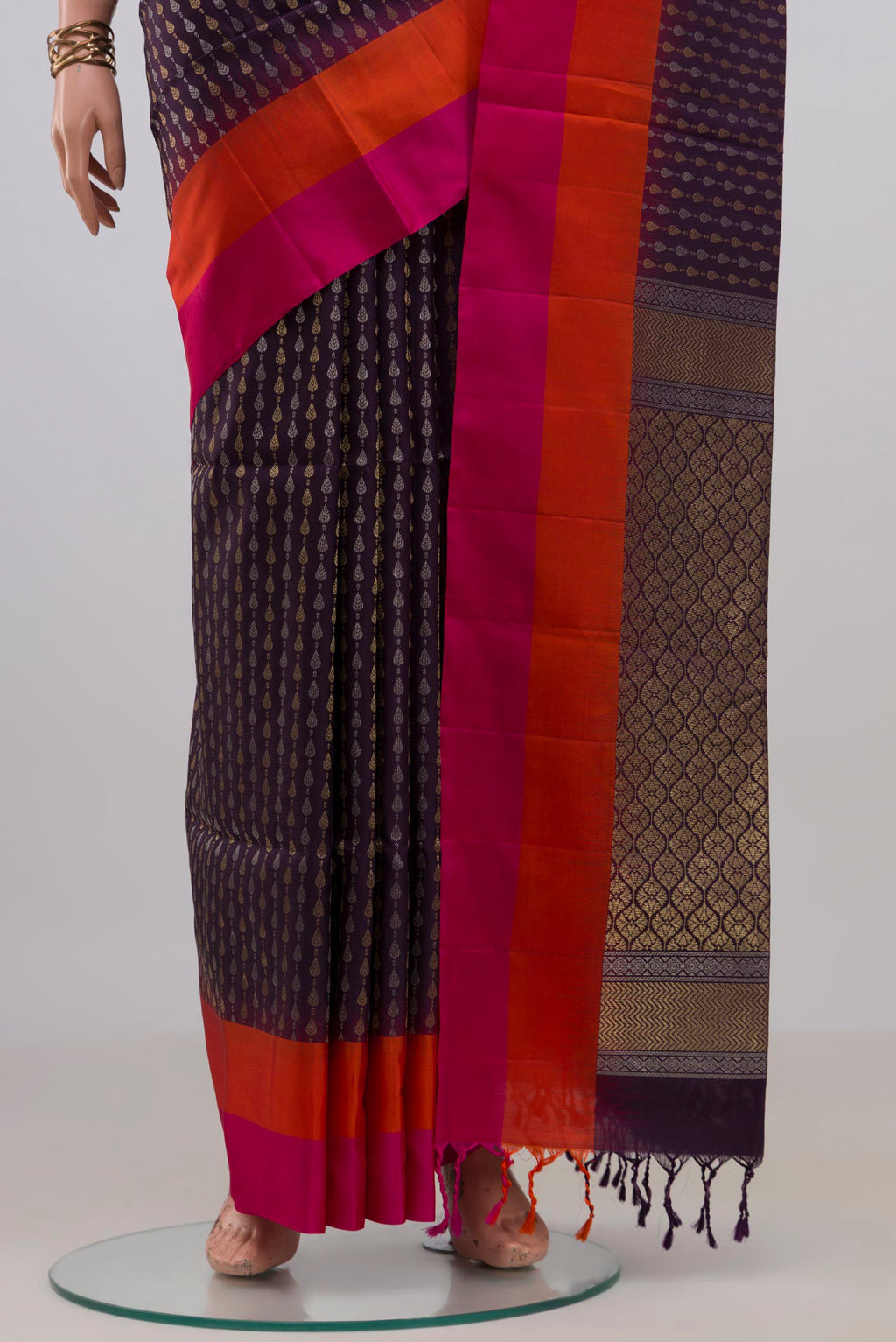 Pleats and pallu of Pure Silk Purple Soft Saree with Zari Butta on the body and Plain Border. 
